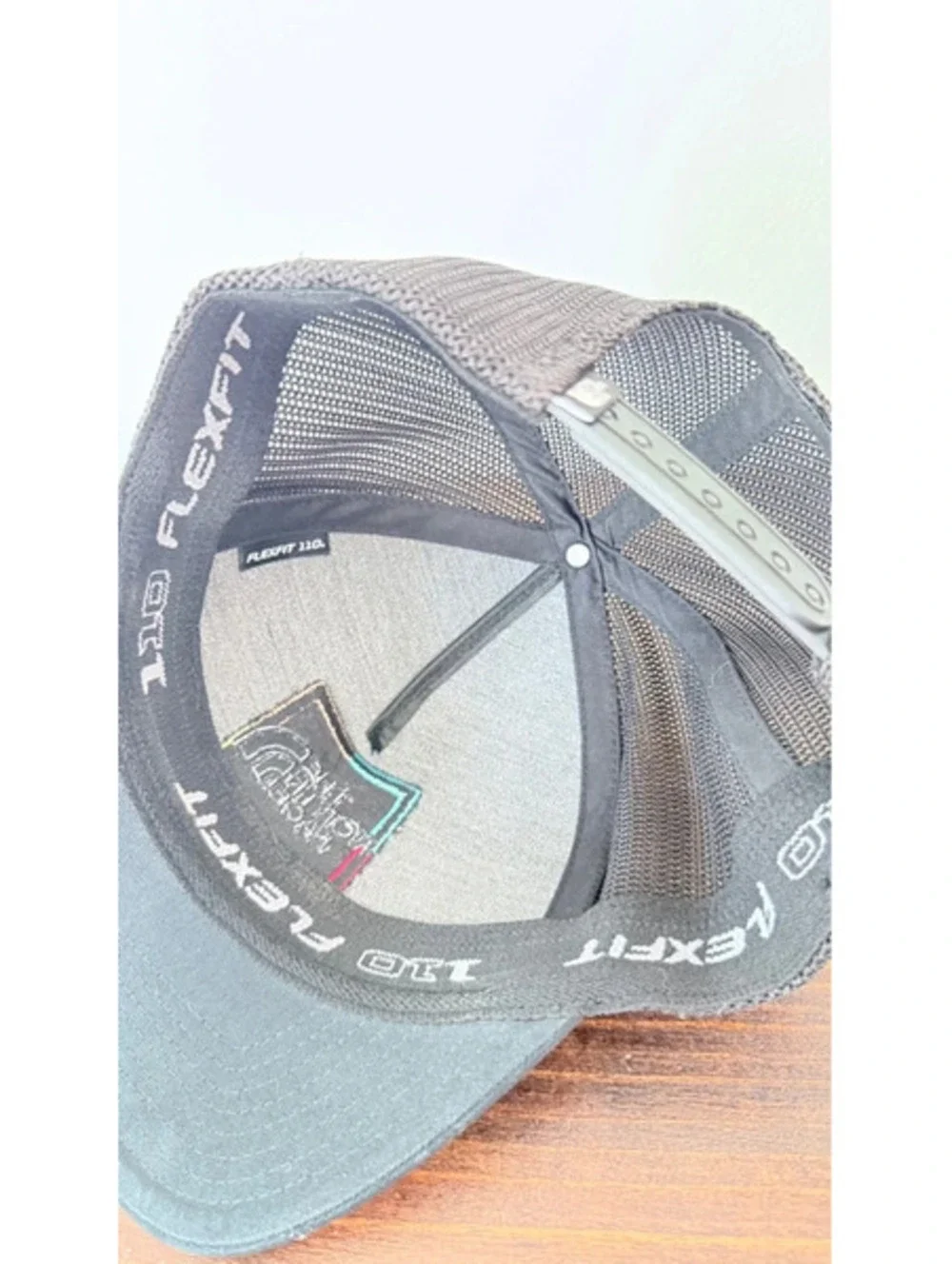 The north face trucker hat black with colorful logo